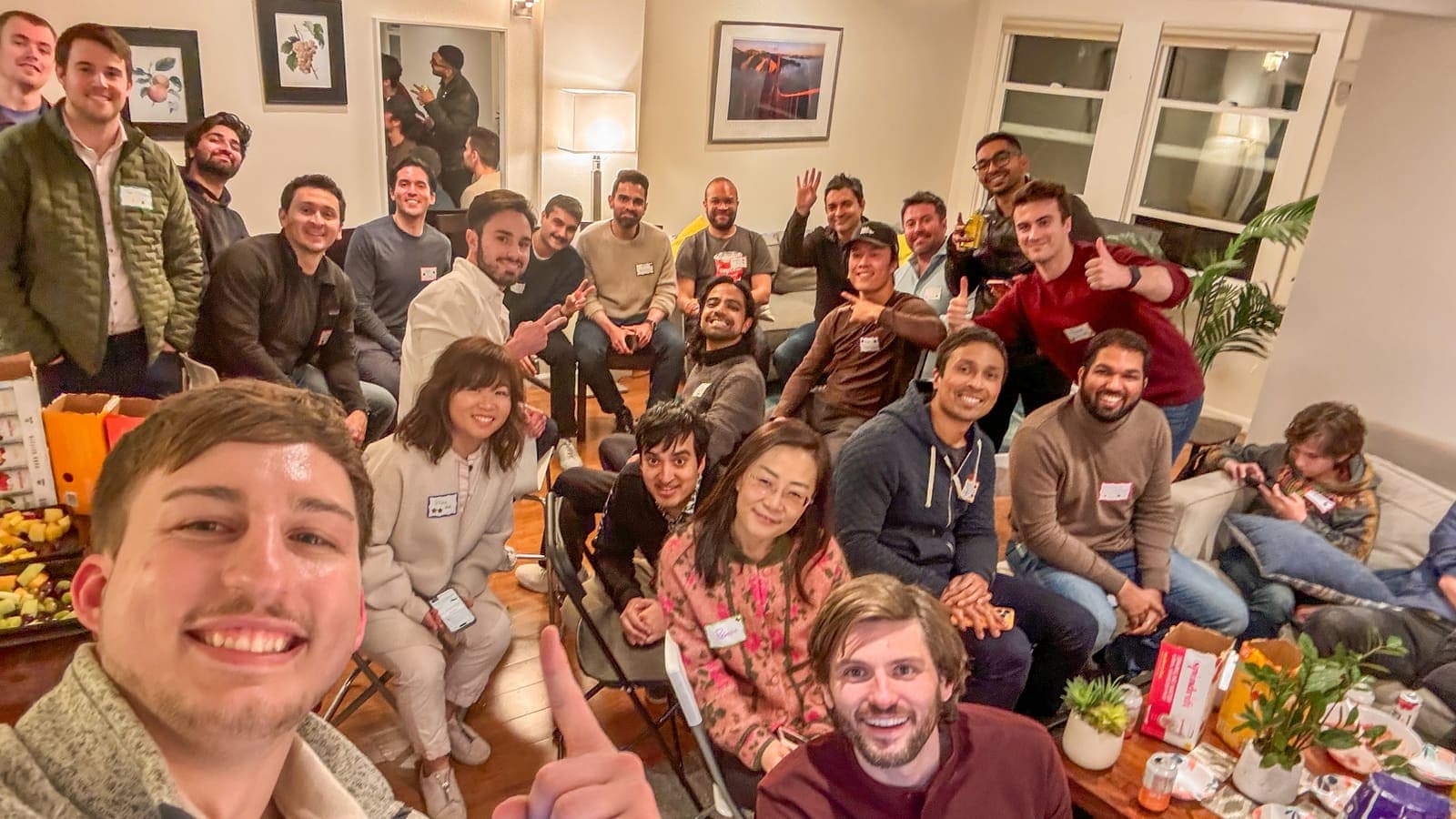 Meetup attendees smiling for a group selfie